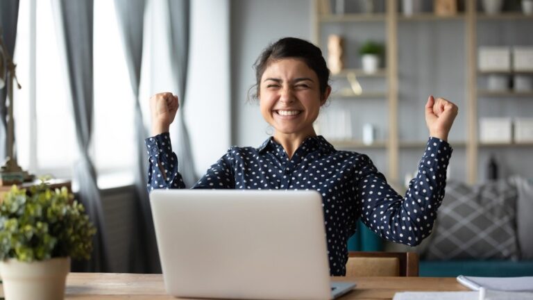 Woman celebrates winning an online auction